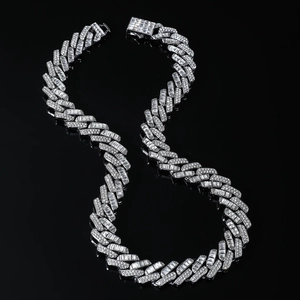 Macro shot of 15mm silver Cuban link chain necklace with full iced-out cubic zirconia stones