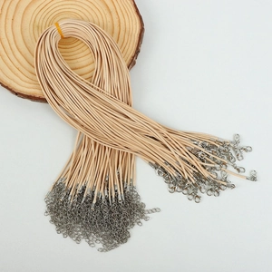 Beige necklace cord bundles with silver lobster clasps and extension chains for pendants