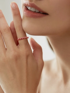 Close-up of elegant S925 silver ring featuring sparkling pink pavé moissanite stones