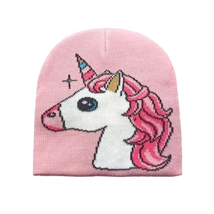Detailed view of pink knitted baby hat featuring colorful unicorn jacquard pattern