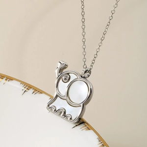 Silver necklace featuring an elephant pendant with white shell inlay and zircon accents