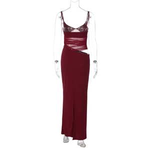 Detail of burgundy backless dress showing sheer mesh waist inserts and high slit hemline
