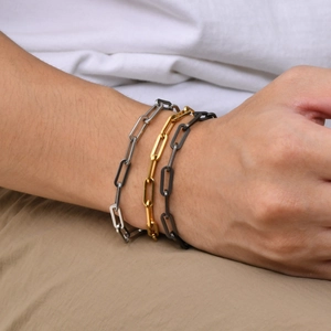 Detailed view of punk style geometric link chains in silver, gold and gunmetal finishes