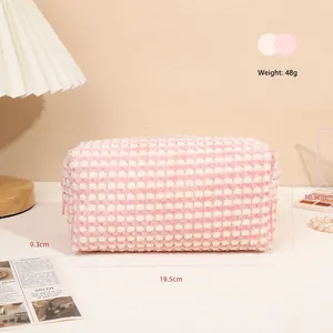 Pink checkered plush makeup bag with 19.5cm length and soft waffle texture design