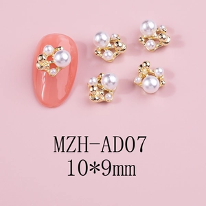 Detail of 3D camellia nail art charms with golden frame and white pearls, 10x9mm size