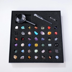 Collection of 49 natural mineral specimens and crystals with magnifying glass and pen tool