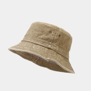 Detail of khaki washed denim bucket hat with metal eyelets and reinforced stitching