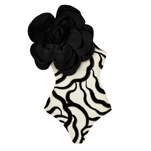 Detail showing 3D black fabric flower ornament and wavy print on one-piece swimsuit