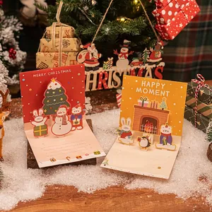 Creative 3D pop-up Christmas cards with festive tree, snowman and penguin illustrations