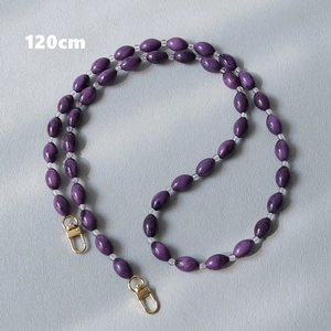 Detailed view of 120cm dark purple acrylic bead chain strap with gold metal buckles