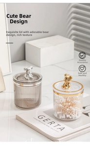 Detailed view of luxury bear-shaped lids and textured glass jars for vanity storage