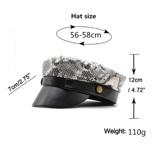 Flat top snakeskin pattern newsboy hat with black leather brim and metal buttons