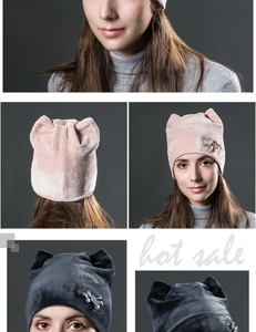 Detail of velvet cat ear beanie showing rhinestone bow accent and soft fabric texture