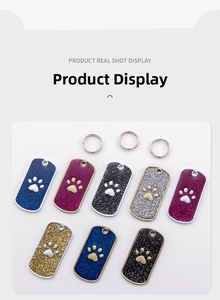 Detailed view of rectangular glitter zinc alloy dog tags with paw print and metal rings