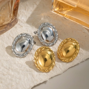 Oval bezel hoop earrings in gold and silver finish with textured rope edges