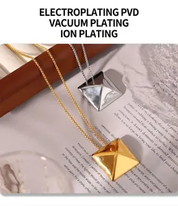 Detailed view of pyramid pendant necklaces in gold and silver with PVD plating