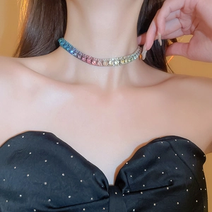 Close-up of rainbow gradient gemstone choker necklace with sparkling stone inlay
