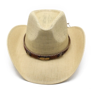 Detail of beige woven cowboy hat with brown strap, wooden beads and gold feather charm