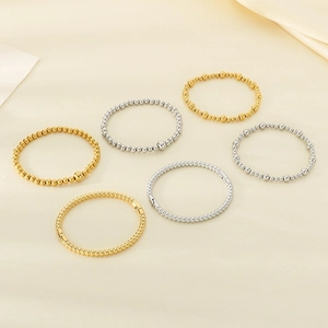 18K gold and silver plated stainless steel beaded bracelet set on beige silk