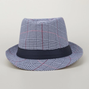 Close-up of classic Fedora hat featuring black and white houndstooth pattern with red lines