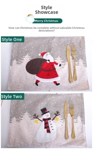 Detail of linen placemats with embroidered Santa and Snowman for Christmas table decor