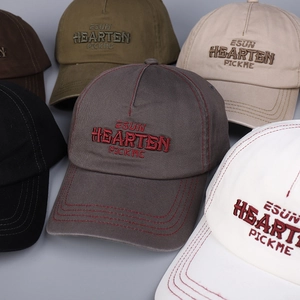 Detailed embroidery and contrast stitching on multi-color cotton baseball caps