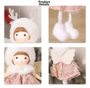 Detail of Christmas plush angel with reindeer antlers, lace skirt, and golden wings