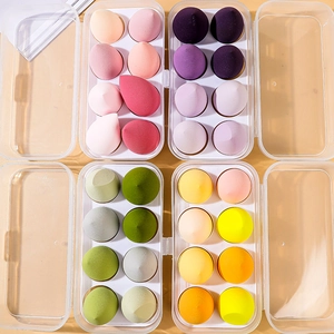 Detailed set of 32 colorful makeup sponges in storage boxes with various teardrop shapes