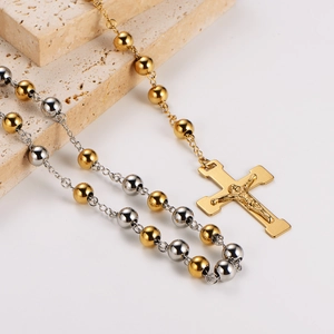 Fashionable gold and silver beaded sweater necklace with a crucifix cross pendant