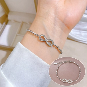 Silver titanium steel bracelet with infinite figure-8 symbol and sparkling cubic zirconia