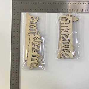 Macro detail of laser-cut wooden Christmas corner door frame decor in natural wood finish