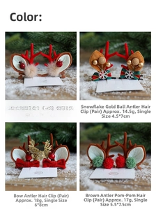 Detail of four different Christmas reindeer antler hair clips with festive decorations