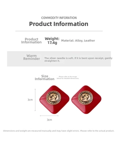 Macro shot of red diamond-shaped leather earrings with vintage gold metal portrait coin