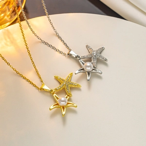 Detailed shot of starfish necklaces in gold and silver finish with pearls and cubic zirconia