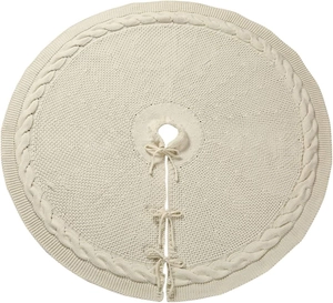 Detailed top view of cream-colored knitted Christmas tree skirt with cable stitch edges