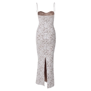 Detailed back view of a white lace maxi dress with cross-back straps and a bottom slit
