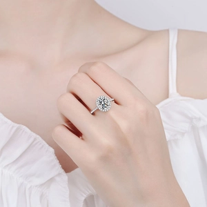 Elegant S925 silver halo ring with oval moissanite stone on a sparkling pavé band