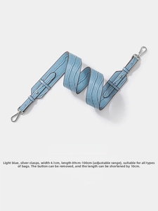 Detailed view of light blue crocodile pattern strap with dimensions and silver metal clasps