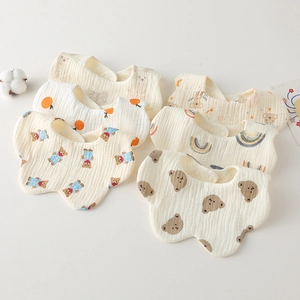Close-up of 6-pack cotton gauze baby bibs featuring assorted cute animal and fruit prints