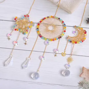 Three-piece gold crystal suncatcher set with star, moon and circle shapes for home decor