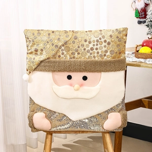 Detail of Christmas chair cover with Santa Claus design and shiny gold sequins