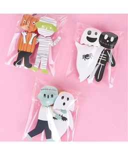 Detail of assorted Halloween lollipop paper cards featuring pumpkin and ghost designs