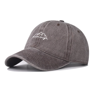 Detail of vintage washed grey baseball cap with white mountain and memory embroidery