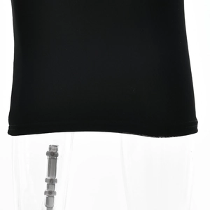 Detailed close-up of the black dress hemline with high-quality stitching and mesh fabric