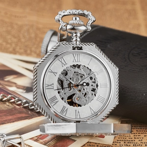 Close-up of vintage octagonal mechanical pocket watch with hollow skeleton movement