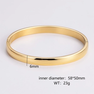 Detailed view of a 6mm wide gold polished oval bangle with hinge closure and measurements