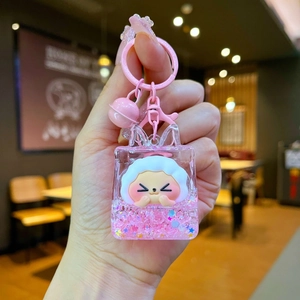Detail of creative acrylic liquid glitter keychain with a cute pink sheep inside