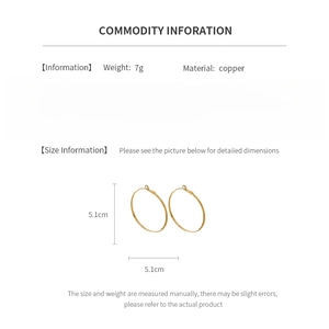 Detail view of 5.1cm gold plated hoop earrings with product material and weight specs