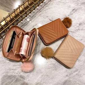 Short PU leather zipper wallet with V-shaped stitching and plush ball charm in three colors