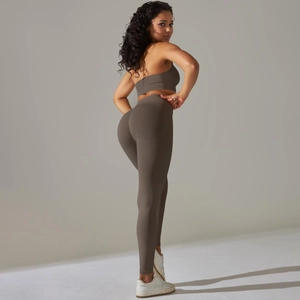 Detail of high-waist seamless brown yoga set showing ribbed waistband and fabric texture